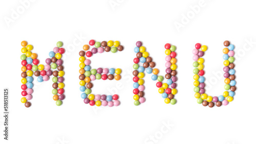Isolated word MENU. Multi-colored round candies on white backgrounds.