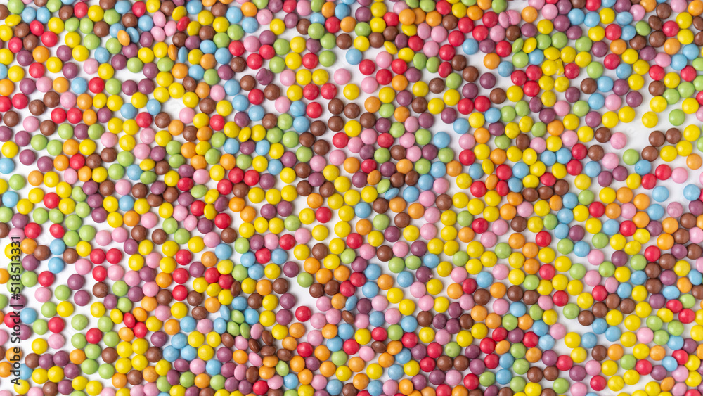 Multi-colored round candies dragee texture background Multi-colored round candies dragee texture background