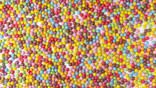 Multi-colored round candies dragee texture background