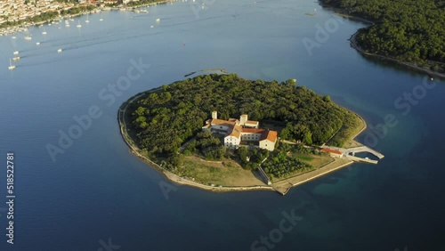 Kosljun Island with Punat town in the background, Krk Island, Adriatic Sea, Croatia photo