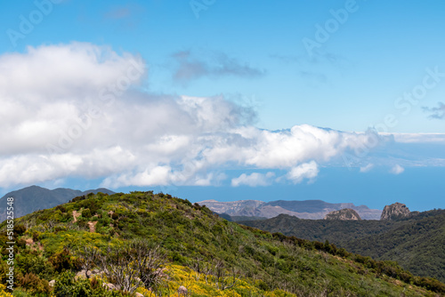 View on lookout Mirador Morro de Agando surrounded by laurel forest near Roque de Agando, Garajonay National Park on La Gomera, Canary Islands, Spain, Europe. Pico del Teide on Tenerife hiding