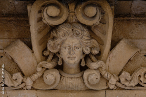 rostro femenino esculpido sobre la linde del portal  Art Nouveau,  Salón Rosa, 1910-1915, características modernistas, Felanitx, Mallorca, Spain photo