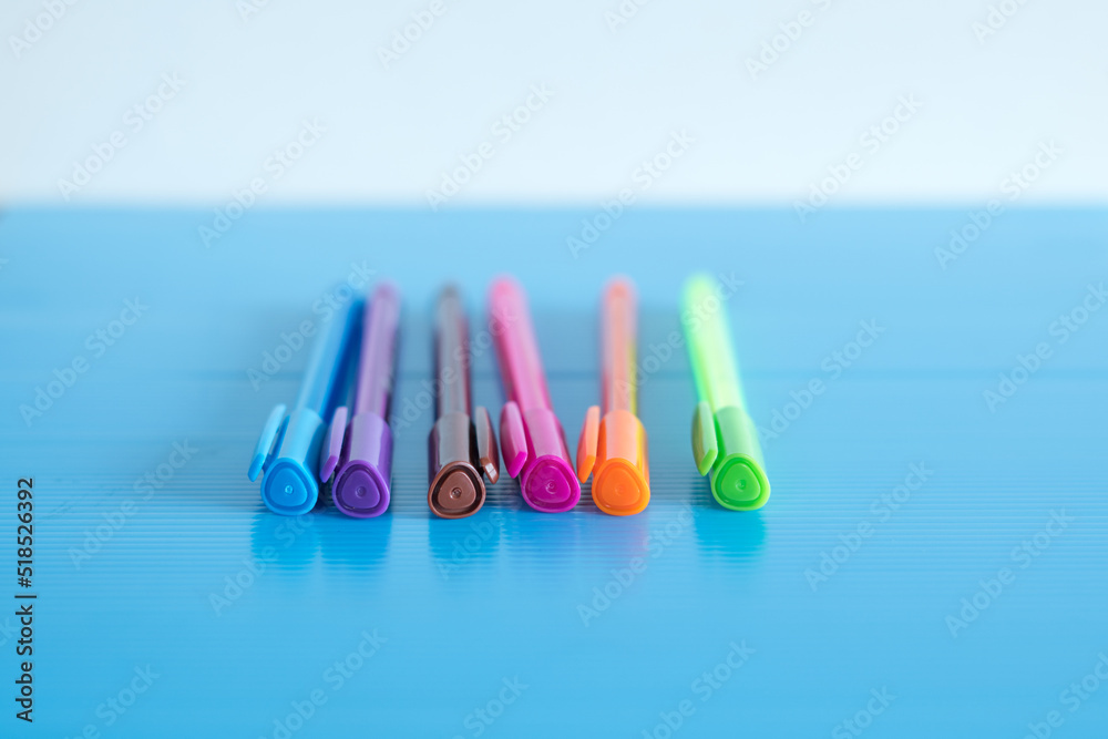 Selective focus shot of colorful felt pens in a row Selective focus shot of colorful felt pens in a row