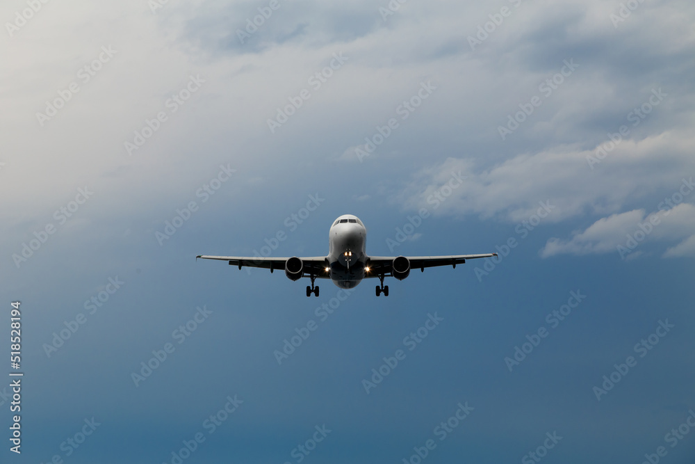 Airplane in the dark stormy sky. Landing plane. Airplane in the dark stormy sky. Landing plane.