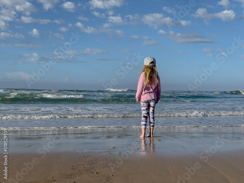 Girl looking out over ocean