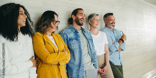 Successful business team laughing cheerfully in an office photo