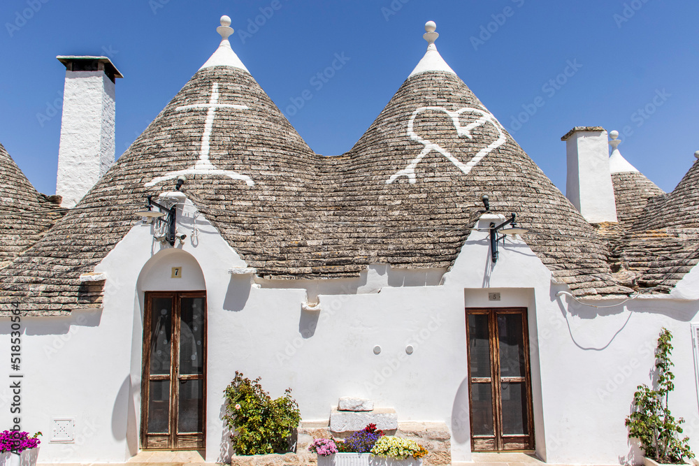 The trulli, typical limestone houses of Alberobello in southern Puglia, Italy, are extraordinary examples of dry stone slab construction, a technique dating back to prehistoric times and still used