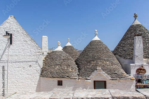 The trulli  typical limestone houses of Alberobello in southern Puglia  Italy  are extraordinary examples of dry stone slab construction  a technique dating back to prehistoric times and still used