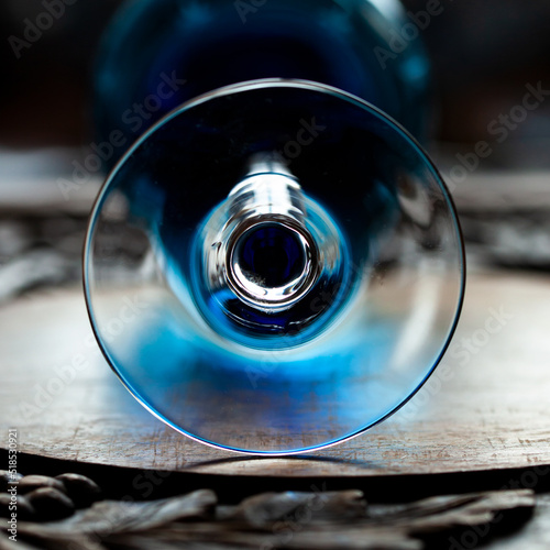 A goblet made of dark blue glass in luxury interior. Blue goblet