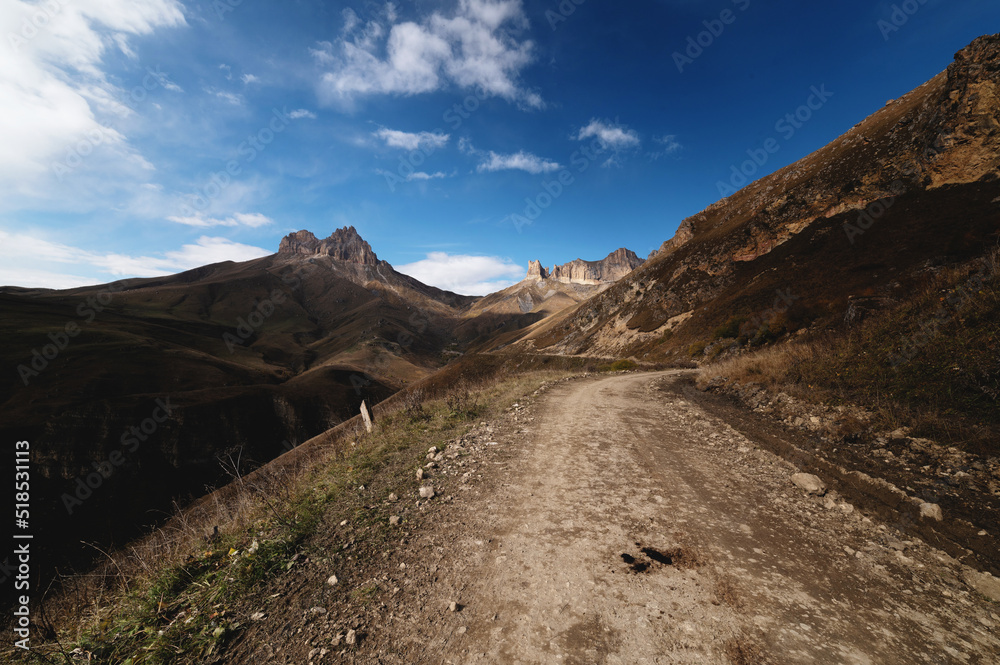 Autumn day on a scenic but difficult 4X4 track located in front of the summit. Off-road, wide angle Autumn day on a scenic but difficult 4X4 track located in front of the summit. Off-road, wide angle