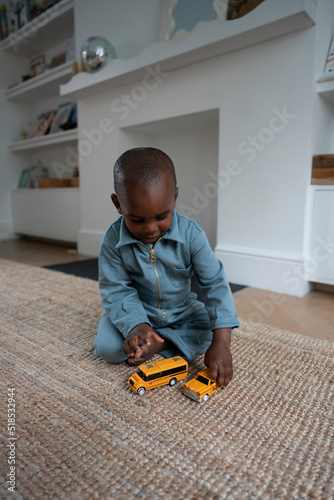 Boy (2-3) playing with toy cars