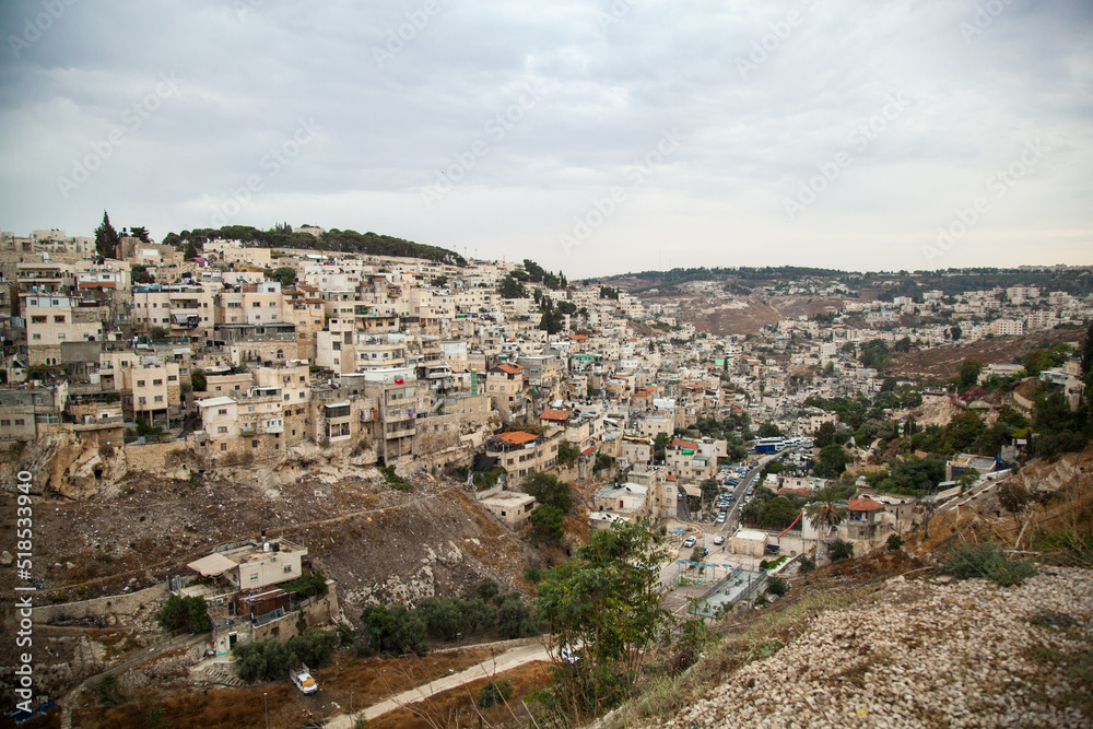 Brazilian slums in Jerusalem. Many small and poor houses in the gorge. Dense historical buildings that look like devastation.