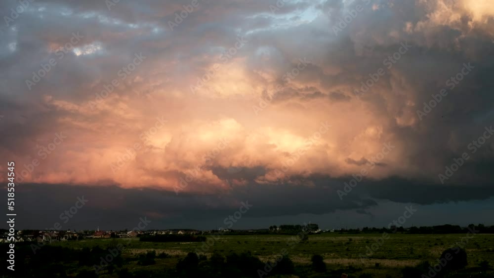 Thick rain clouds in the sky after a summer evening rain. The sky before sunset. Thick rain clouds in the sky after a summer evening rain. The sky before sunset.