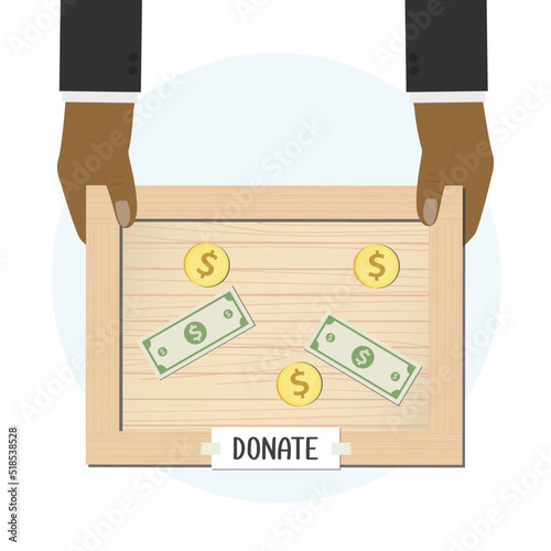Hands holding wooden donation box. Social responsibility, african american businessman collects money for needy and refugees. Financial aid, support, helping hand, money in box. Top view.