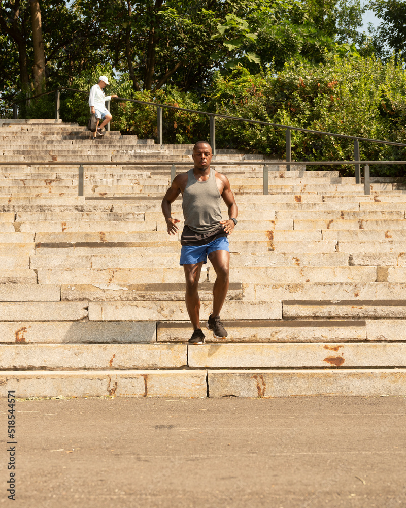 Athletic man running down steps Athletic man running down steps