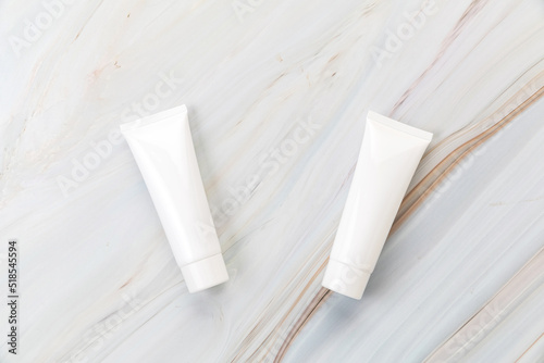 cream tube skincare package on background marble