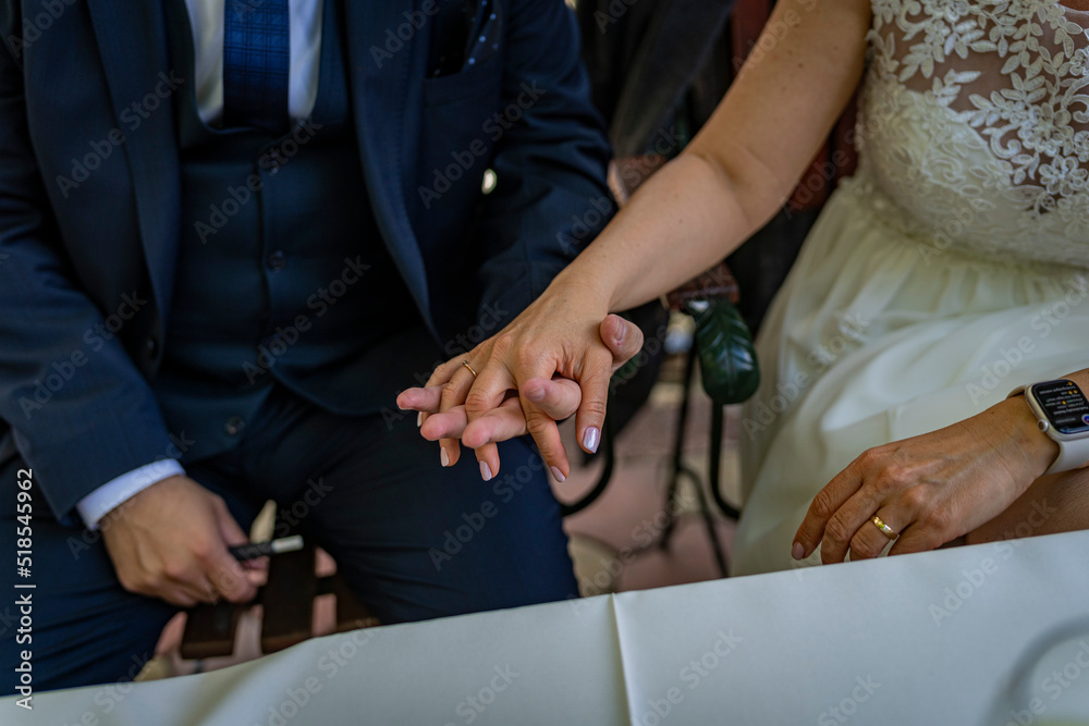 bride and groom holding hands