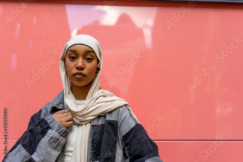 Portrait of young woman wearing hijab photo