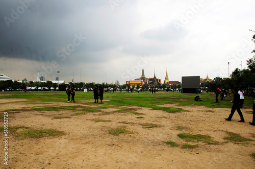 Thai people and foreign travelers walking travel visit in Sanam Luang public garden park and Phra Kaew temple or Wat Phra Si Rattana Satsadaram and Grand Palace on October 16, 2016 in Bangkok Thailand