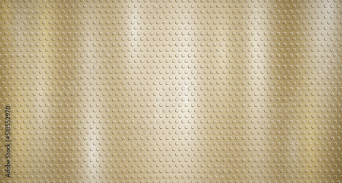 Abstract metallic background in golden colors with highlights and a texture of small voluminous convex circles