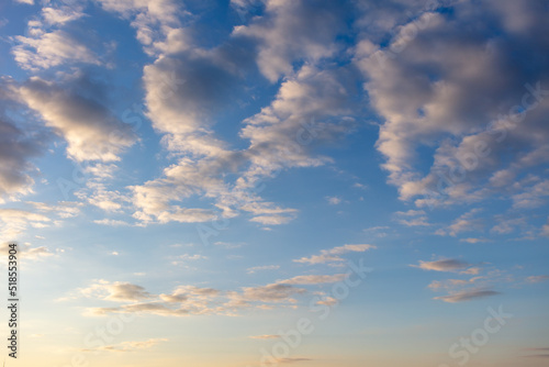 Clouds in the sky at sunset .