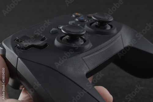 a black console controller with a black background