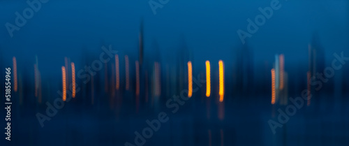 Wallpaper Mural Motion Blurr of industry background with defocused cargo dock terminal in sea with colorful bokeh lights at midnight. Urban and industry backdrop Torontodigital.ca