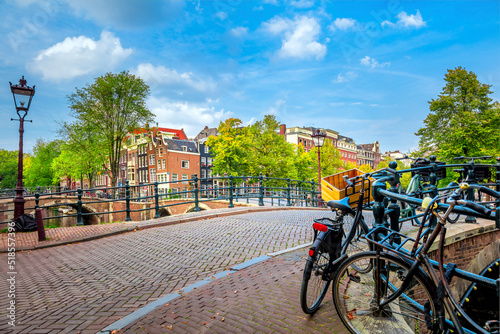 Photography Soul of Amsterdam in one photo - leaning houses, bridges, canals, bicycles and lanterns