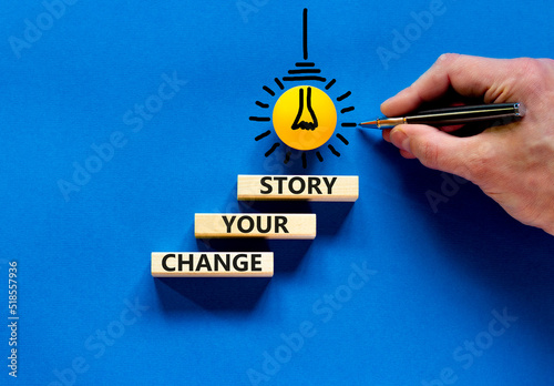 Change your story symbol. Concept words Change your story on wooden blocks on a beautiful blue table blue background. Businessman hand. Business finacial and change your story concept. Copy space. photo