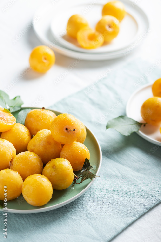 Fresh sweet yellow plums on the table Fresh sweet yellow plums on the table