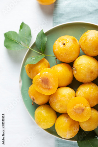 Fresh sweet yellow plums on the table
