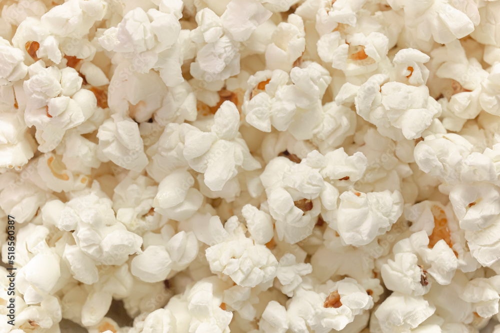 Scattered popcorn. Close-up picture of fluffy salted popcorn. background texture. View from above - Top view.
