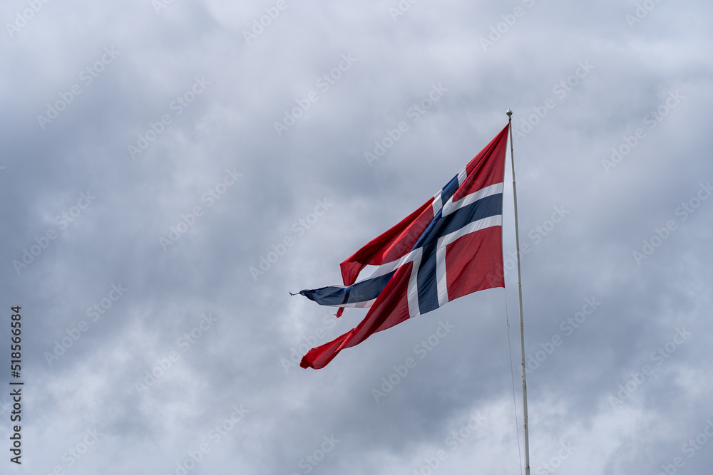 Norwegian Flag blowing in the wind on an overcast day 