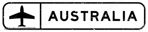 Grunge black australia word with plane icon square rubber seal stamp on white background