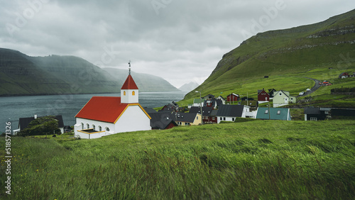Church and village of Mikladalur, Kalsoy island, Faroe Islands, Denmark. Popular tourist attraction. Travel photo lifestyle.