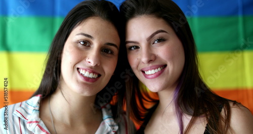 Two LGBT young women smiling at camera