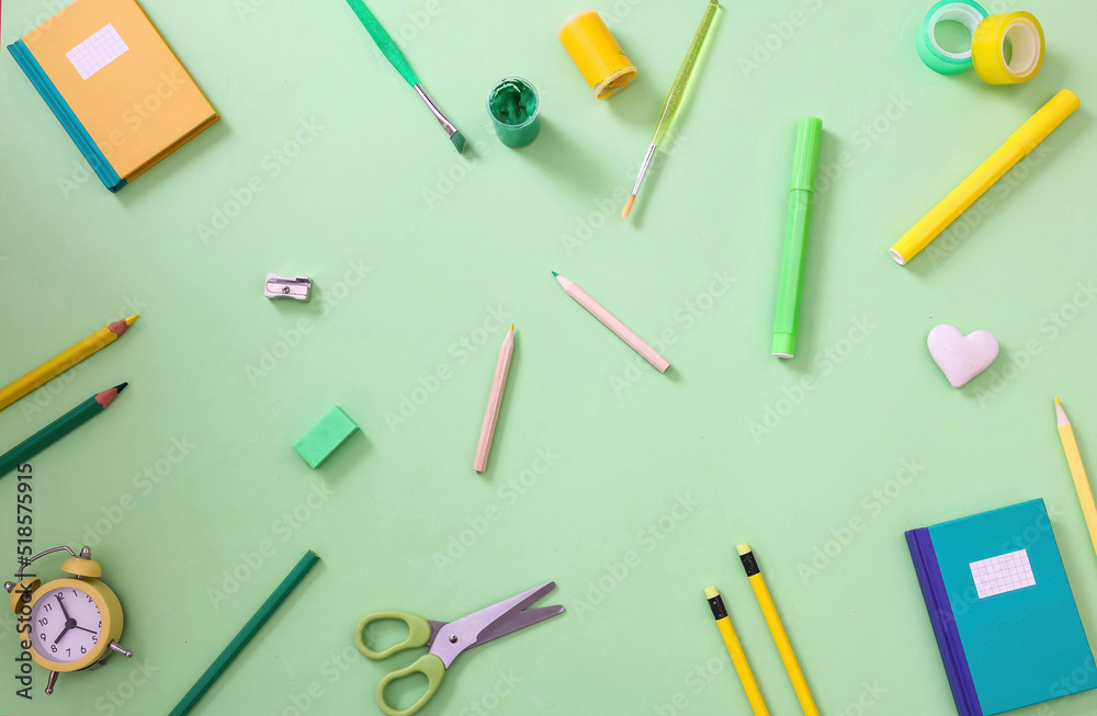 School office supplies background. Back to school. Pastel color stationery flat lay, top view.