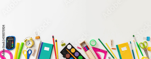 Back to school border, banner. Supplies isolated on white color background, top view