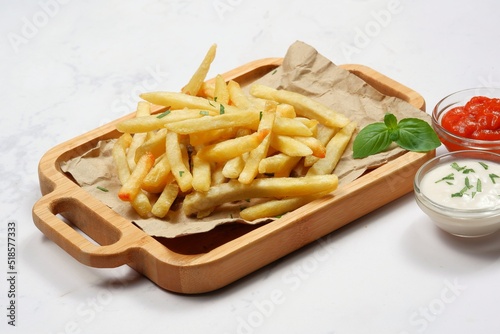 French fries with Mayonnaise and chili sauce on white background