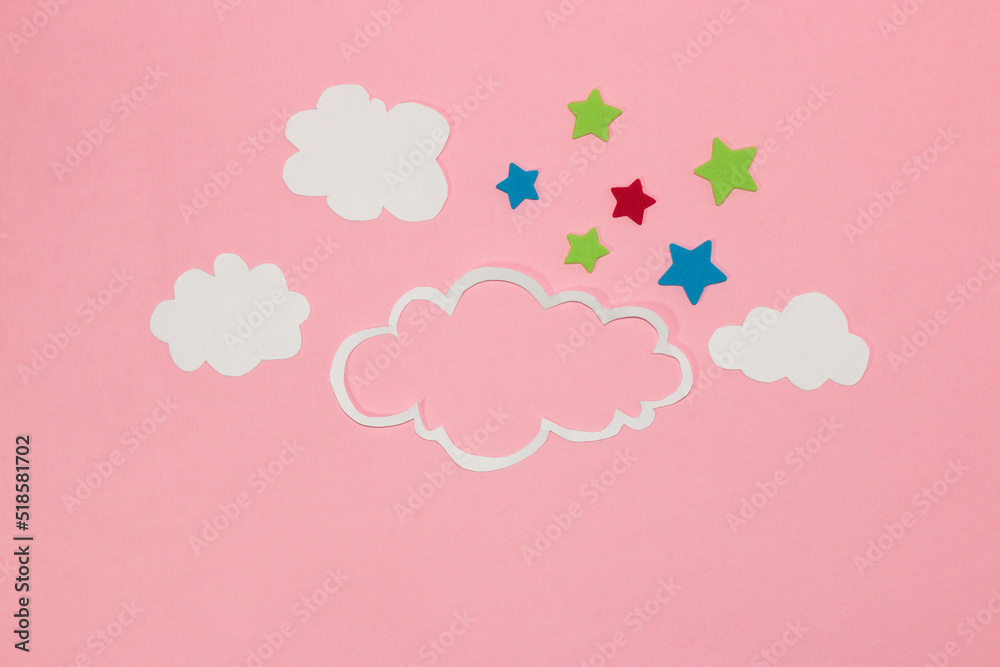 cloud as copy space, small clouds and colorful stars around the cloud, pink background, creative art modern design, abstract idea, clear air, pink sky
