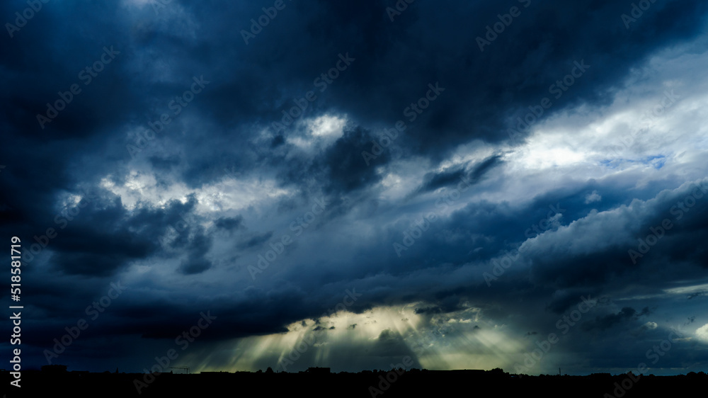 Rays of sunlight through storm clouds Rays of sunlight through storm clouds