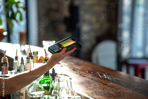 paying with smartphone at a bar