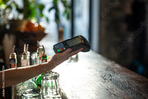 paying with smartphone at a bar