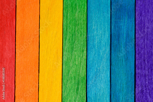 Rainbow LGBT pride flag crafted from painted wooden boards. Tolerance and diversity concept. Symbol of sexual minorities from painted wooden boards arranged vertically.