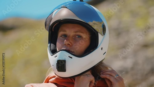 Cinematic downhill longboard session. Young woman skateboarding and making tricks between the curves on a mountain pass. Concept about extreme sports and people photo