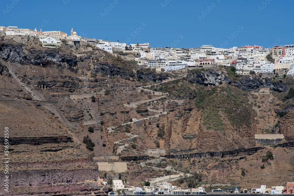 Panoramic view of the picturesque village of Fira Santorini and the old port Gialos of Santorini Greece