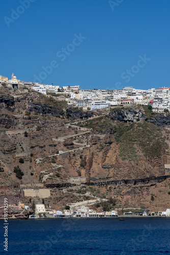 Fototapeta Naklejka Na Ścianę i Meble -  Panoramic view of the picturesque village of Fira Santorini and the old port Gialos of Santorini Greece