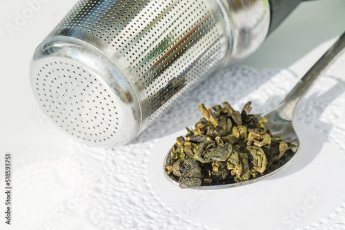 Steel tea strainer infuser and green tea. Tool for thermos mug. photo