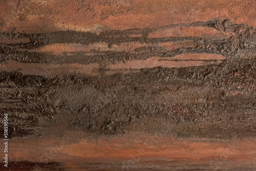 Brown rusty metal surface with dark traces of fuel oil old steel texture industrial background