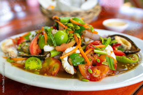 Papaya Salad (SomTam)with seafood,Thai food, spicy seafood salad.